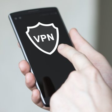 turbo vpn overview vpn services hand holding smartphone vpn on touchscreen